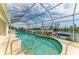 Sparkling pool with screened enclosure, waterfront views, and inviting outdoor space at 10640 Ayear Rd, Port Charlotte, FL 33981