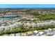 An aerial view of the community featuring single-Gathering homes with mature landscaping at 1104 Yosemite Dr, Englewood, FL 34223