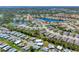 An aerial view of the community featuring single-Gathering homes and serene ponds throughout at 1104 Yosemite Dr, Englewood, FL 34223