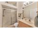 Bathroom featuring a shower, a sink, and a large mirror on the wall at 1104 Yosemite Dr, Englewood, FL 34223