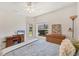 Inviting bedroom with neutral tones, complemented by natural light and includes a built-in desk and dresser at 1104 Yosemite Dr, Englewood, FL 34223