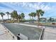 Well-kept community bocce ball court with lush landscaping and nearby tennis court at 1104 Yosemite Dr, Englewood, FL 34223