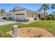 Charming home with manicured lawn and inviting curb appeal showcases pride of ownership and a welcoming atmosphere at 1104 Yosemite Dr, Englewood, FL 34223