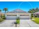 Charming one story home featuring a two car garage in a lovely neighborhood with sidewalks and a manicured lawn at 1104 Yosemite Dr, Englewood, FL 34223