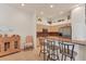 Well-lit kitchen with stainless steel appliances, breakfast bar, and display shelves above cabinets at 1104 Yosemite Dr, Englewood, FL 34223