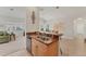 Well-equipped kitchen with a breakfast bar and view of the living and dining areas at 1104 Yosemite Dr, Englewood, FL 34223