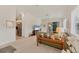 Bright living room with neutral decor, sliding door to patio, and open floor plan to kitchen, creating a spacious living area at 1104 Yosemite Dr, Englewood, FL 34223