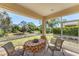 Relaxing screened-in patio with a table and chairs overlooking a well-maintained yard and lush landscaping at 1104 Yosemite Dr, Englewood, FL 34223