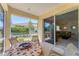Charming screened patio with comfortable seating offers a relaxing outdoor space to enjoy the scenery at 1104 Yosemite Dr, Englewood, FL 34223