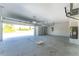 Spacious two-car garage featuring a newly installed garage door and an ample amount of storage space at 12218 Edwards Rd, Port Charlotte, FL 33981