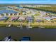 Community aerial view of waterfront homes with private docks along a scenic canal at 14564 Gaspar Loop, Port Charlotte, FL 33981