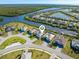Scenic aerial view of waterfront homes with private docks and beautiful landscaping along canals at 14564 Gaspar Loop, Port Charlotte, FL 33981