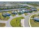 An elevated shot of the neighborhood showcases its manicured lawns and waterfront homes at 14564 Gaspar Loop, Port Charlotte, FL 33981