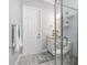 Clean bathroom with a glass-enclosed shower, modern fixtures, and neutral tile at 14564 Gaspar Loop, Port Charlotte, FL 33981