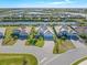 Beautiful single-story waterfront home with a three-car garage and lush tropical landscaping at 14564 Gaspar Loop, Port Charlotte, FL 33981