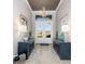 Inviting foyer with elegant lighting, dual console tables, and views of the front yard through glass doors at 14564 Gaspar Loop, Port Charlotte, FL 33981