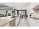 Bright kitchen features white cabinets, granite countertops and stainless steel appliances at 14564 Gaspar Loop, Port Charlotte, FL 33981