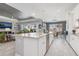 Open kitchen layout with a granite island, stainless appliances, and seamless flow to the living area at 14564 Gaspar Loop, Port Charlotte, FL 33981