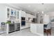 Stylish kitchen with a wine fridge, granite countertops, stainless appliances, and ample cabinet storage at 14564 Gaspar Loop, Port Charlotte, FL 33981