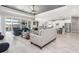 Open-concept living area with tile flooring, modern furniture, and a view of the pool at 14564 Gaspar Loop, Port Charlotte, FL 33981