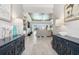 Spacious living area with tile flooring, modern decor, and a view of the pool at 14564 Gaspar Loop, Port Charlotte, FL 33981