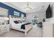 Serene primary bedroom with neutral colors, a ceiling fan, and sliding glass doors to the patio at 14564 Gaspar Loop, Port Charlotte, FL 33981
