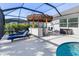 Enjoy this outdoor living space complete with covered bar and stainless steel accents at 14564 Gaspar Loop, Port Charlotte, FL 33981