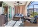 Cozy screened outdoor patio with comfortable seating, perfect for relaxing and entertaining at 14564 Gaspar Loop, Port Charlotte, FL 33981