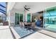 Inviting outdoor patio with dining area, ceiling fan, and seamless access to the pool at 14564 Gaspar Loop, Port Charlotte, FL 33981