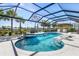 Stunning pool area featuring a spa, tiki bar, and lounge chairs surrounded by lush landscaping at 14564 Gaspar Loop, Port Charlotte, FL 33981