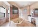 This bathroom features a large soaking tub, walk-in shower, and vanity area at 14810 Ingraham Blvd, Port Charlotte, FL 33981