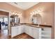 A spacious bathroom offering double vanities with granite countertops and plenty of storage at 14810 Ingraham Blvd, Port Charlotte, FL 33981