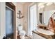 Nautical bathroom with granite countertops, a glass-enclosed shower, and stylish fixtures at 14810 Ingraham Blvd, Port Charlotte, FL 33981