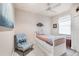 This bedroom is cozy with soft chair, lots of storage space and lots of light at 14810 Ingraham Blvd, Port Charlotte, FL 33981