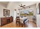 A well-lit dining room with a bay window and a view of the screened-in patio at 14810 Ingraham Blvd, Port Charlotte, FL 33981