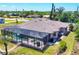 Exterior angle of waterfront home featuring a screened-in patio, pool, and scenic backyard at 14810 Ingraham Blvd, Port Charlotte, FL 33981