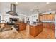A spacious kitchen with granite countertops, stainless steel appliances, and an island at 14810 Ingraham Blvd, Port Charlotte, FL 33981