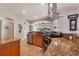 The kitchen features granite countertops, stainless steel appliances, and a modern range hood at 14810 Ingraham Blvd, Port Charlotte, FL 33981