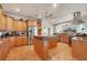 A spacious kitchen featuring granite countertops, stainless steel appliances, and custom wood cabinets at 14810 Ingraham Blvd, Port Charlotte, FL 33981