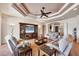 Comfortable living room with plush seating, a decorative ceiling, and an entertainment center with a large TV screen at 14810 Ingraham Blvd, Port Charlotte, FL 33981