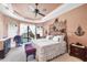 A cozy main bedroom with water views and nautical themed decor at 14810 Ingraham Blvd, Port Charlotte, FL 33981
