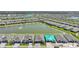 Expansive aerial view of a residential community with multiple homes and serene ponds at 1607 Laurel Brook Ln, Port Charlotte, FL 33953