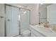 Bathroom featuring a glass-enclosed shower, a sleek vanity with modern fixtures, and bright lighting at 1607 Laurel Brook Ln, Port Charlotte, FL 33953