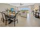 Charming dining area with a view of the backyard and comfortable seating arrangement at 1607 Laurel Brook Ln, Port Charlotte, FL 33953