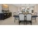Elegant dining room featuring a stylish buffet and views of the modern kitchen at 1607 Laurel Brook Ln, Port Charlotte, FL 33953