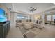 Spacious living room with a large sectional sofa and serene water views at 1607 Laurel Brook Ln, Port Charlotte, FL 33953