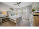 Well-lit main bedroom with a wooden dresser, nightstands, decorative lamps, and ample natural light at 1607 Laurel Brook Ln, Port Charlotte, FL 33953
