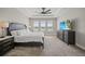 Comfortable main bedroom boasts natural light, stylish decor, and a relaxing atmosphere at 1607 Laurel Brook Ln, Port Charlotte, FL 33953