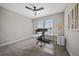 Bright office area with treadmill and a large desk with dual monitors at 1607 Laurel Brook Ln, Port Charlotte, FL 33953