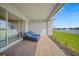Outdoor patio overlooking a serene lake, perfect for relaxation and enjoying the waterfront view at 1607 Laurel Brook Ln, Port Charlotte, FL 33953